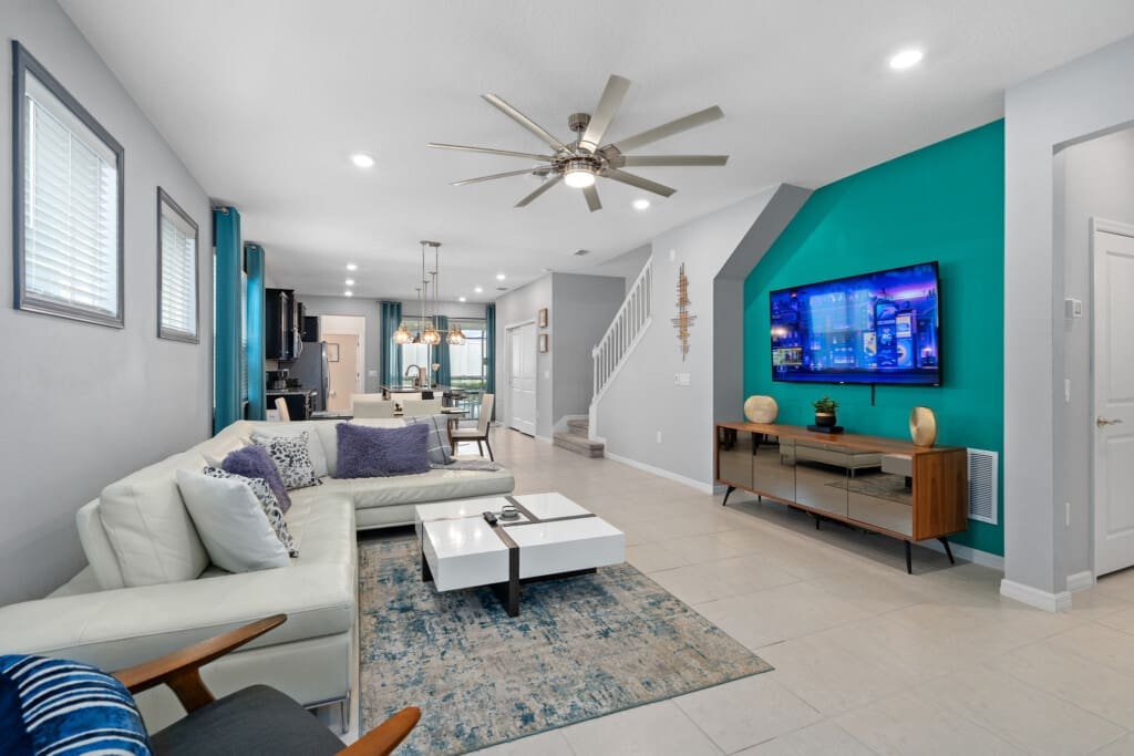 Modern living area inside a Windsor Island Resort vacation home, showing why many travelers ask: Is Windsor Island Resort high end, with stylish décor, open layout, and upscale finishes.