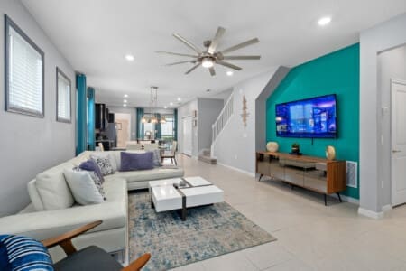 Modern living area inside a Windsor Island Resort vacation home, showing why many travelers ask: Is Windsor Island Resort high end, with stylish décor, open layout, and upscale finishes.